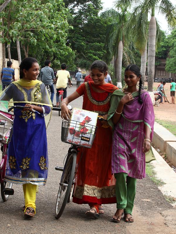 Girls walking down the street in India